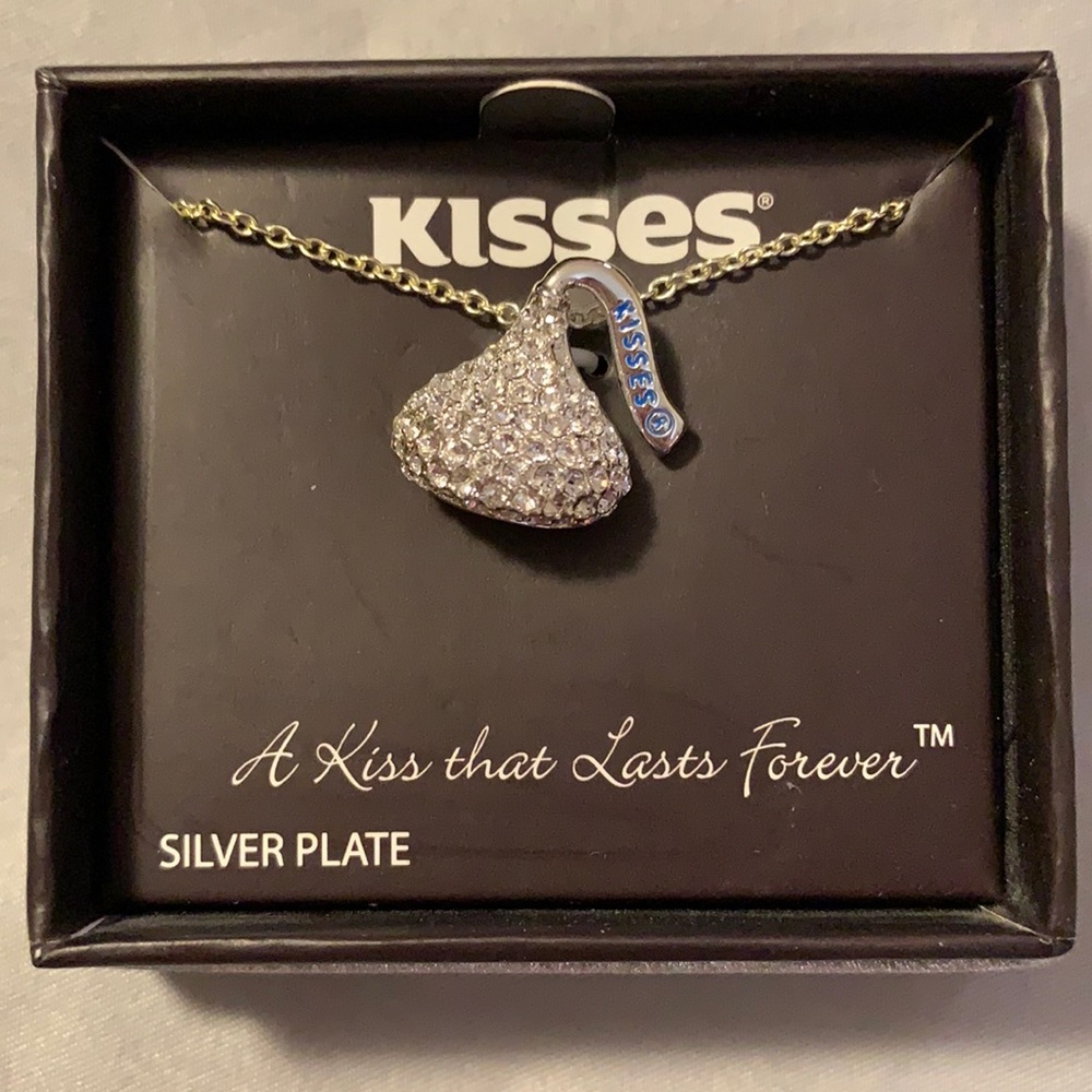 Silver plated 18” chain Hershey’s KISS necklace.  KISS has brass crystals.  New